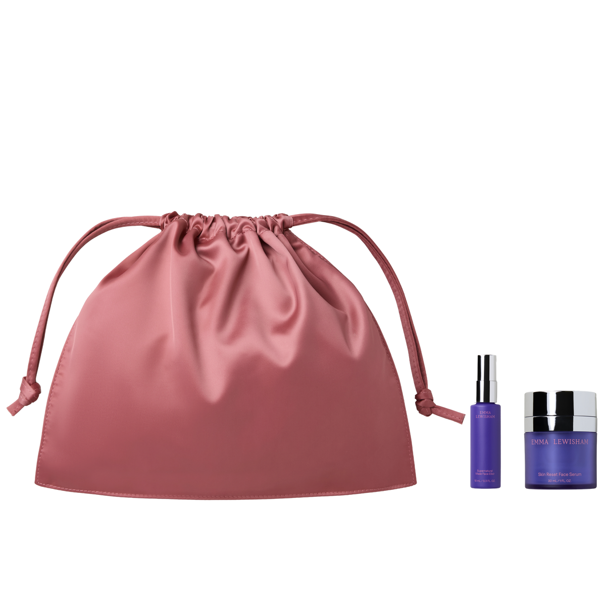 Pink Emma Lewisham beauty bag with Skin Reset Face Serum and Supernatural Vitale Face Elixir minis.