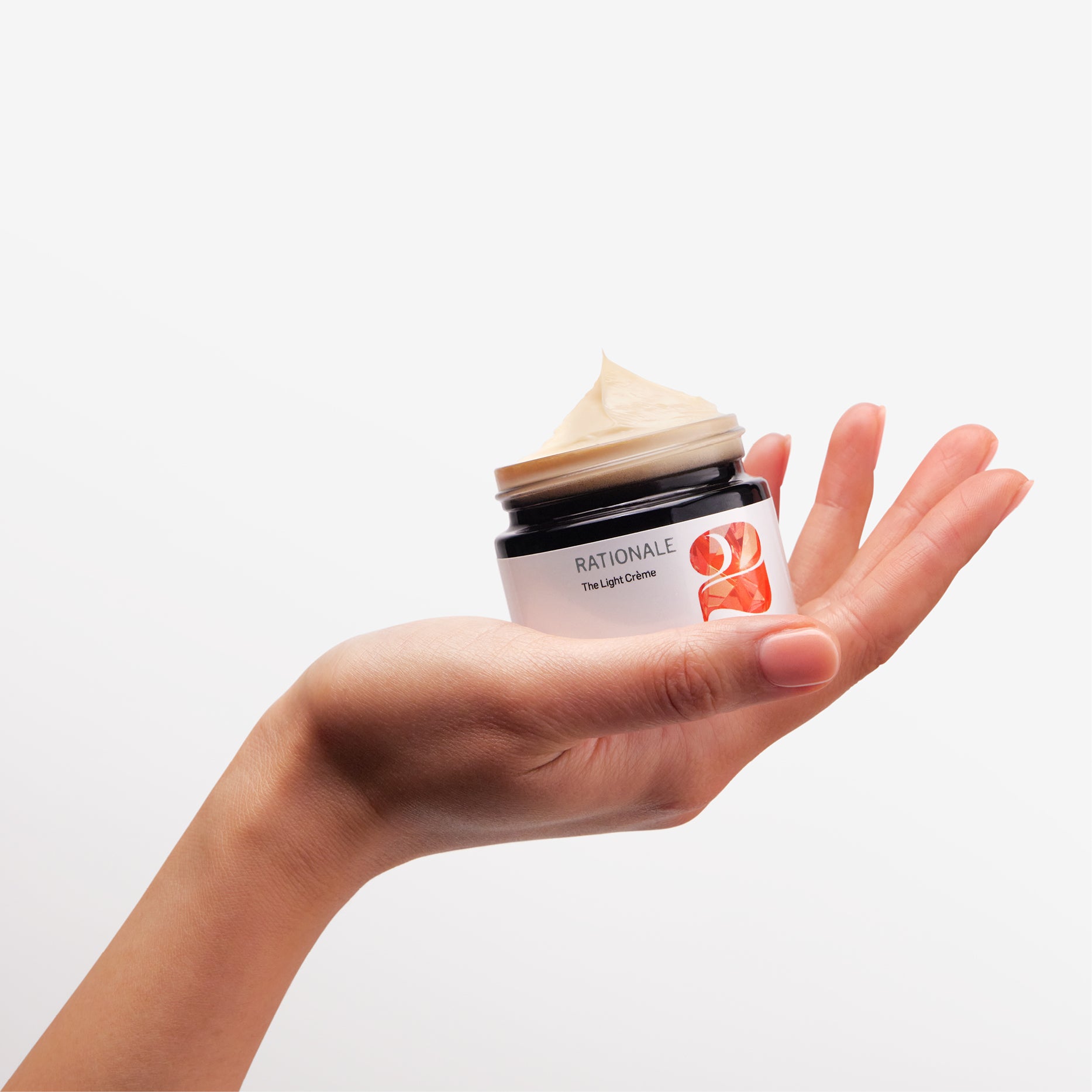 Rationale_2_Brightening_Light_Creme_In_Hand.jpg
