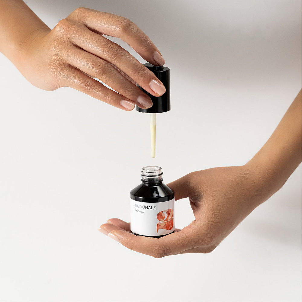 Rationale_2_Brightening_Serum_In_Hand.jpg